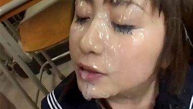 Captivating teen masturbating as she gets a facial in gang bang