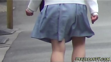 Asian teens squat and pee