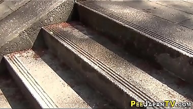 Asian seen peeing herself