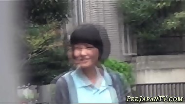 Uniformed teens pissing