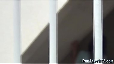 Teens pee on the street