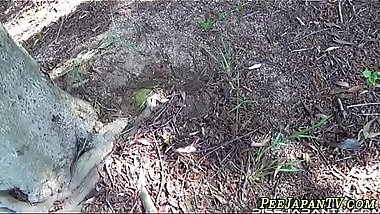 Uniformed asian teen pees