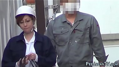 Asian lady pisses herself