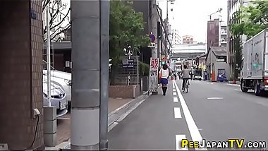 Asian pisses in car park