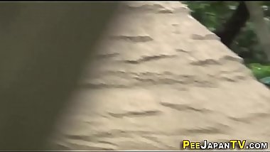 Asian babe watched peeing