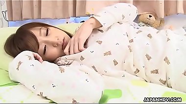 Cute Asian teen masturbates to an orgasm in her bed